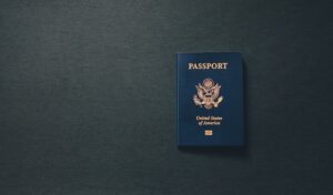a passport on a black surface