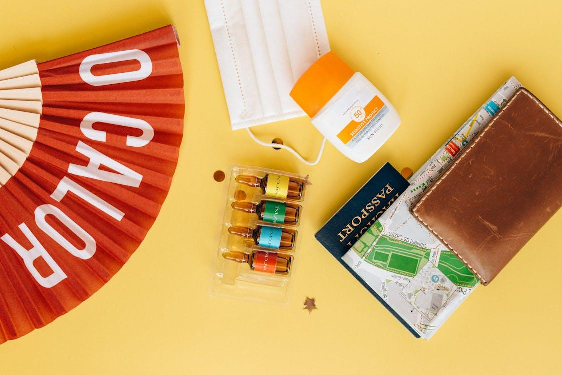 A map and passport neatly stored in a leather wallet, ensuring easy access while traveling.