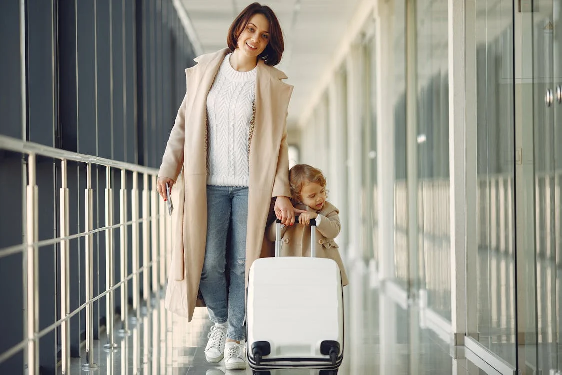 A mother at the airport with her daughter