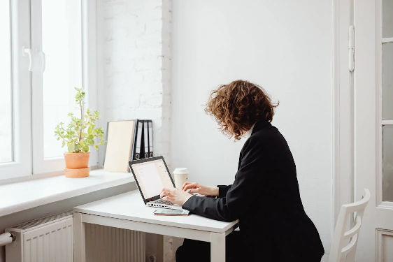 a woman working on a laptop 